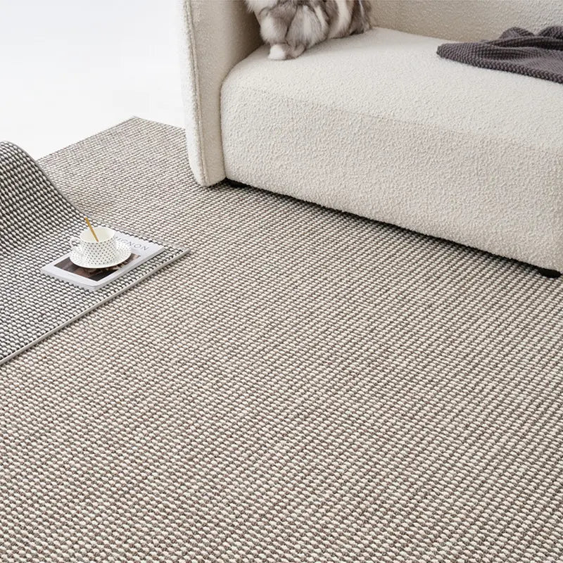 Minimalist pebble loop wool blend rug in natural beige and grey tones, soft and dense weave