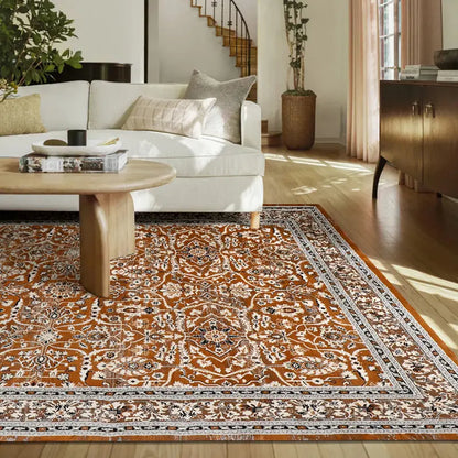 Rust orange Persian-style area rug in modern living room with white sofa and wood decor
