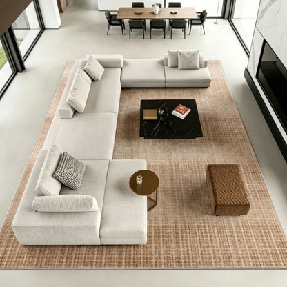 Large light brown Siena area rug under a sectional sofa in a modern living room