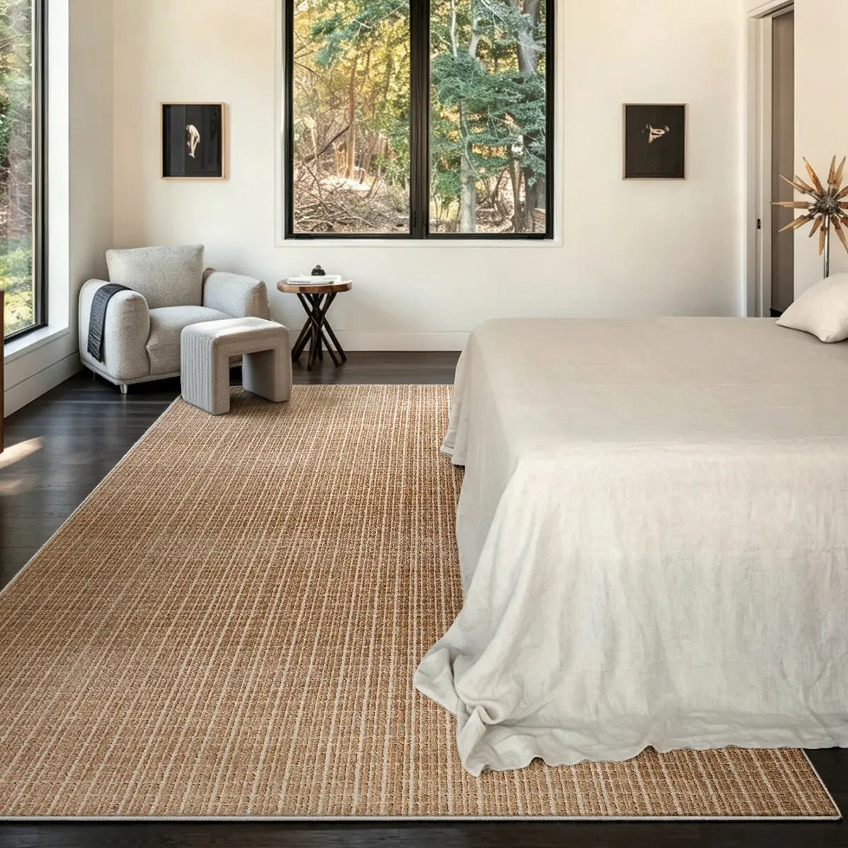 Siena light brown beige rug in a neutral bedroom with white bedding and dark wood floors