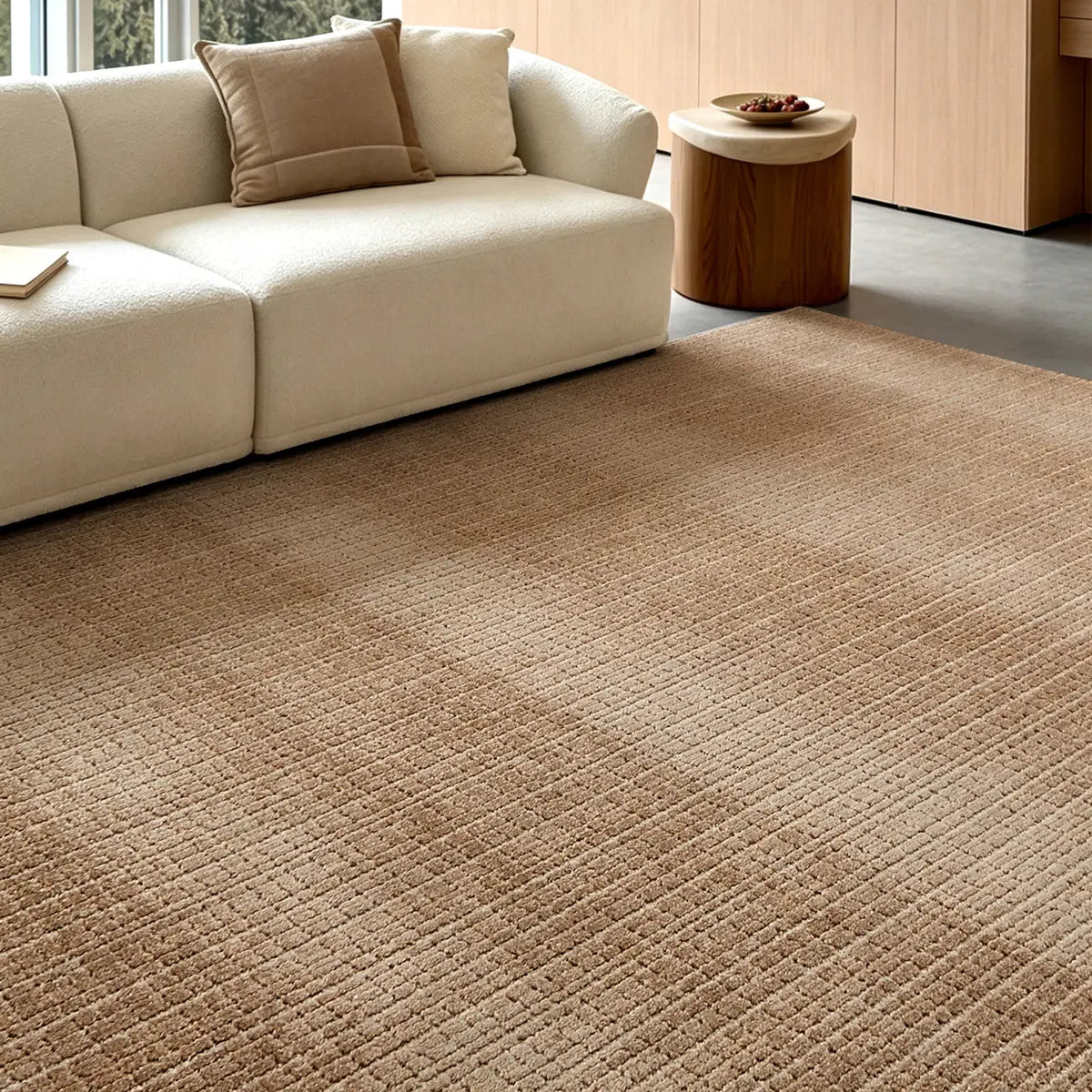 Siena light brown beige textured rug with a cream sofa in a modern living room