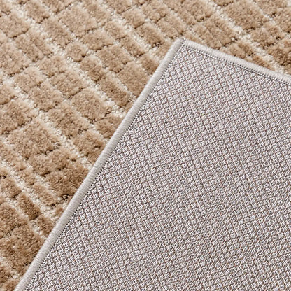 Back of the Siena textured rug showing the woven backing and finished bound edge