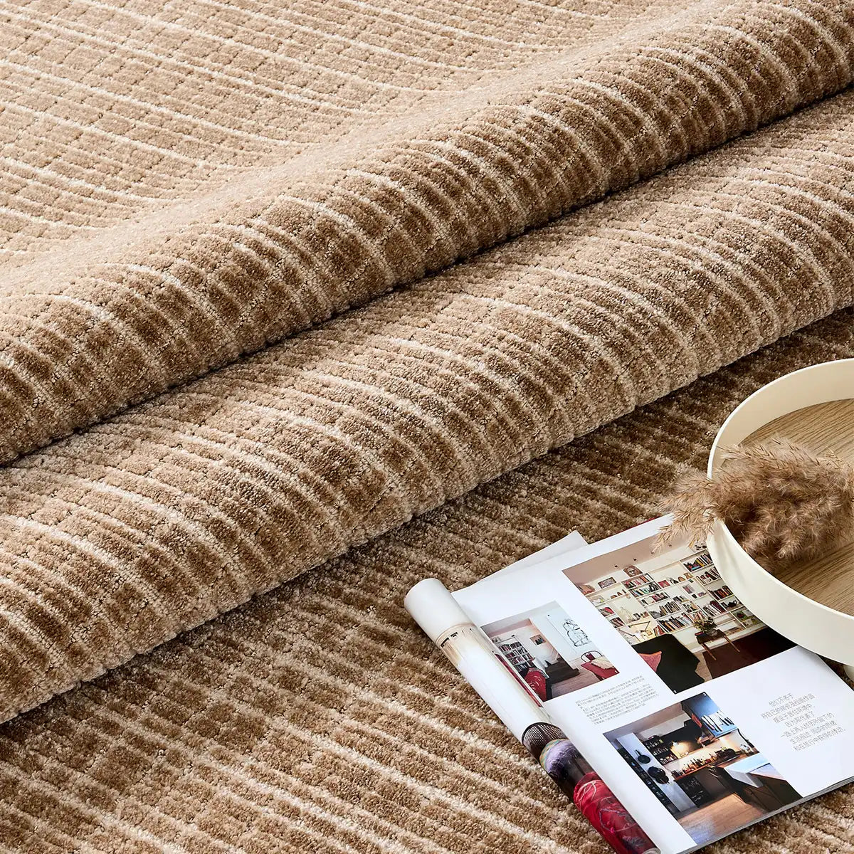 Close-up of the Siena wool blend rug showing raised linear texture in light brown and beige