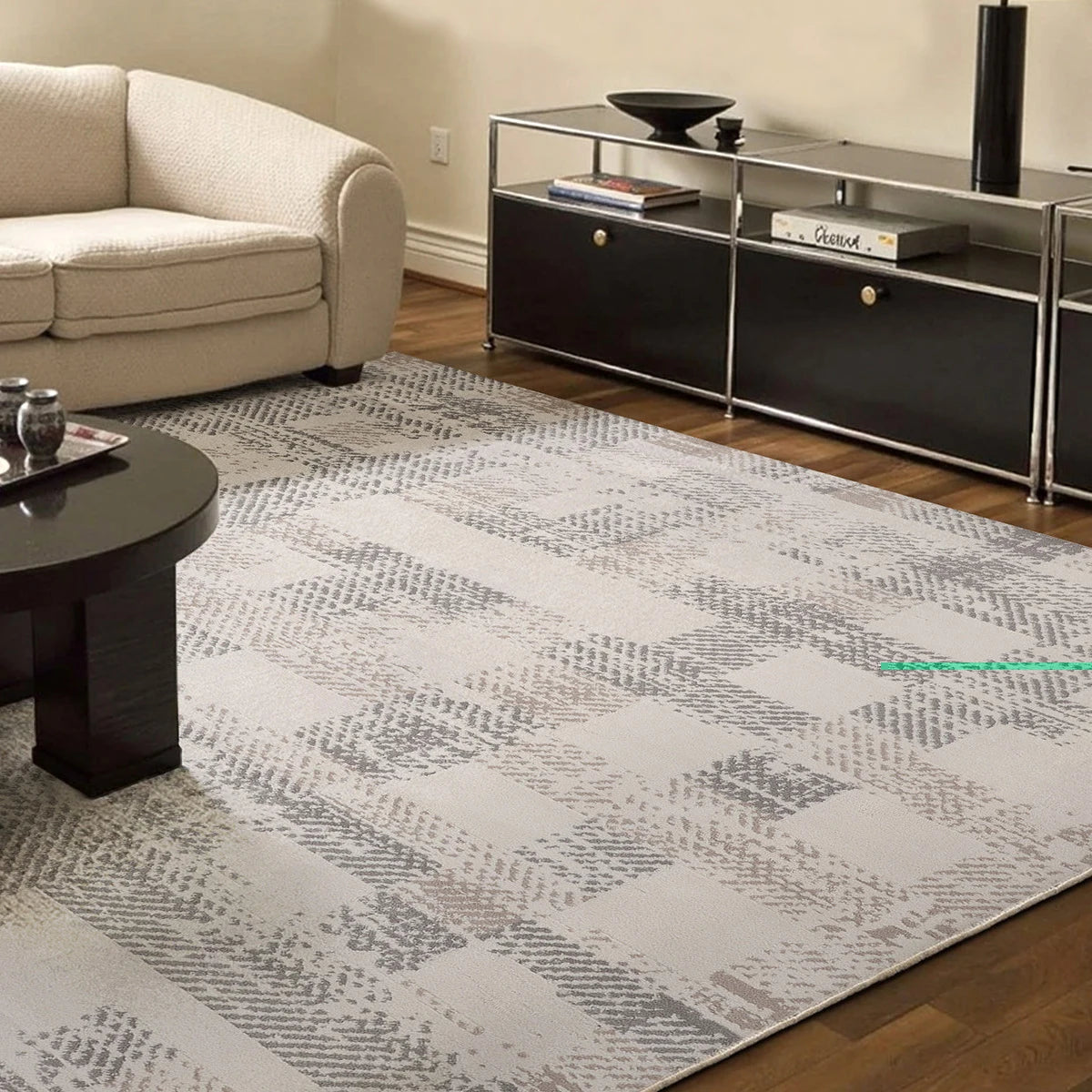 soft cream geometric area rug styled in a modern living room by Tervannor