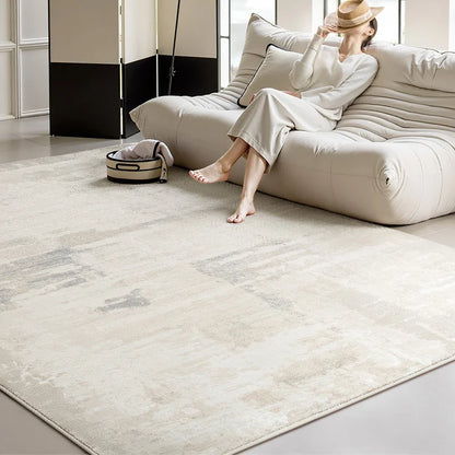 Minimalist living room with a neutral tone woven rug featuring a soft abstract pattern, enhancing the serene and cozy atmosphere