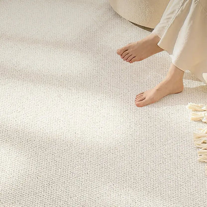 Sunlit wool carpet with looped texture, offering barefoot comfort and a serene, nature-inspired aesthetic for modern interiors