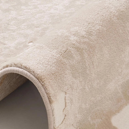 Taupe ivory abstract area rug close-up showing soft woven texture and subtle modern pattern