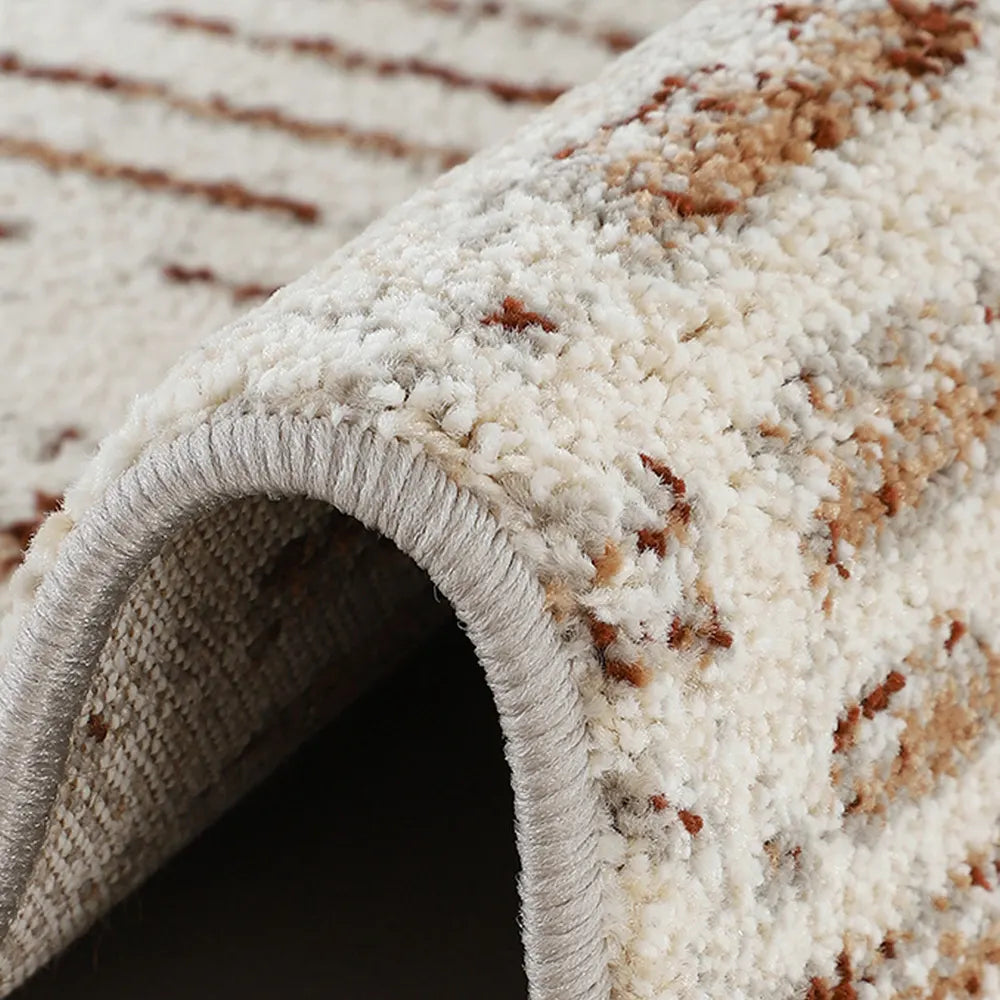 Close-up of area rug edge with dense pile and clean bound finish
