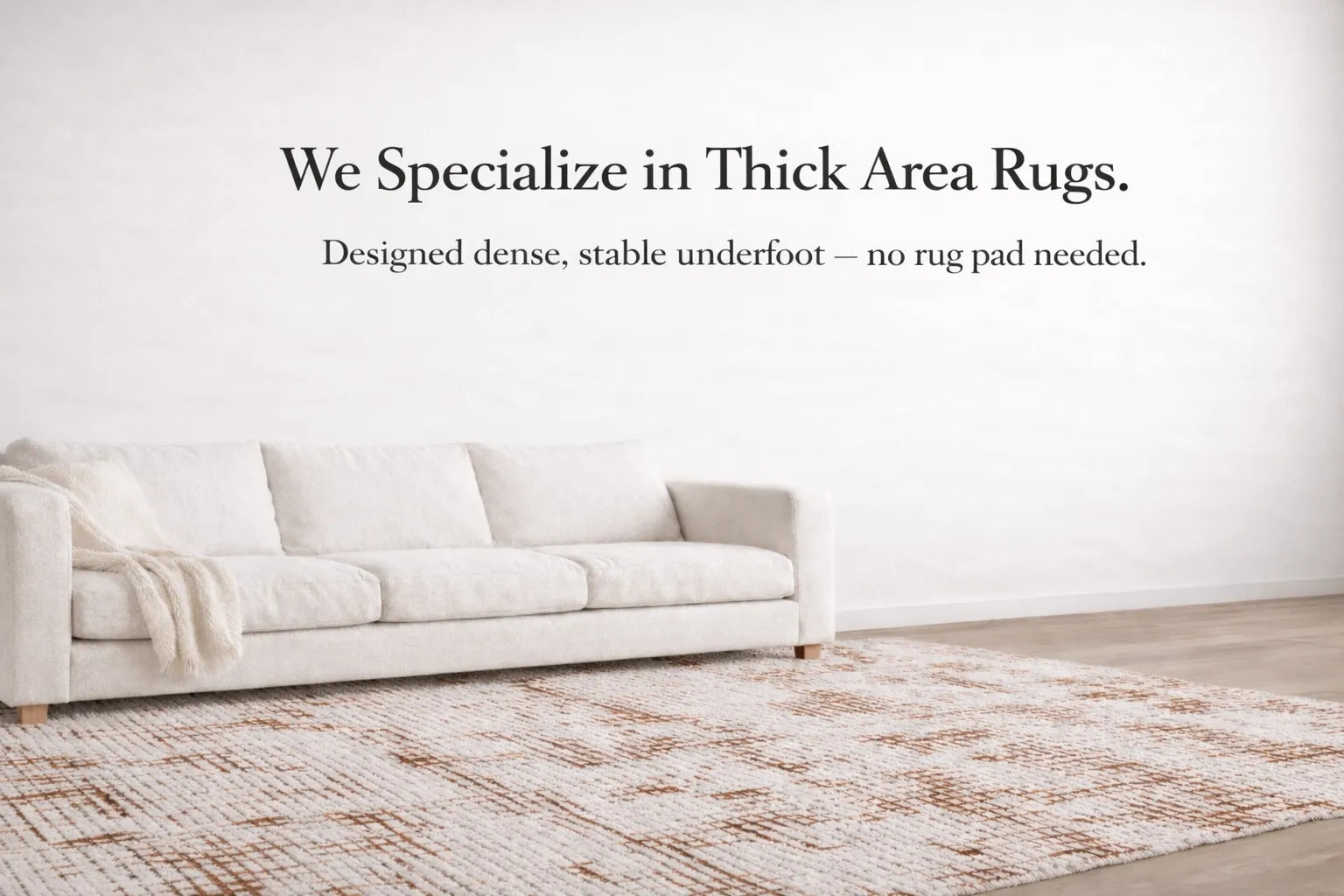 Thick modern area rug in living room, dense and stable underfoot, no rug pad needed