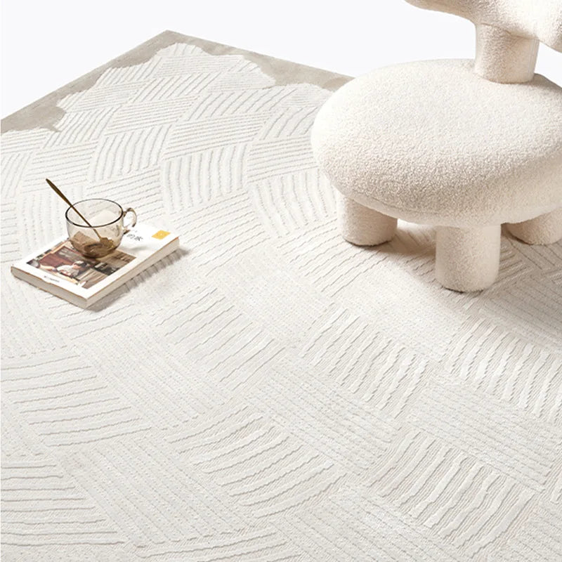 Close-up view of a luxury 3D woven area rug with a raised geometric texture in soft beige, highlighting its plush feel, intricate design, and premium craftsmanship