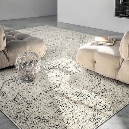 close-up of a textured beige and black area rug showing soft surface and detailed pattern