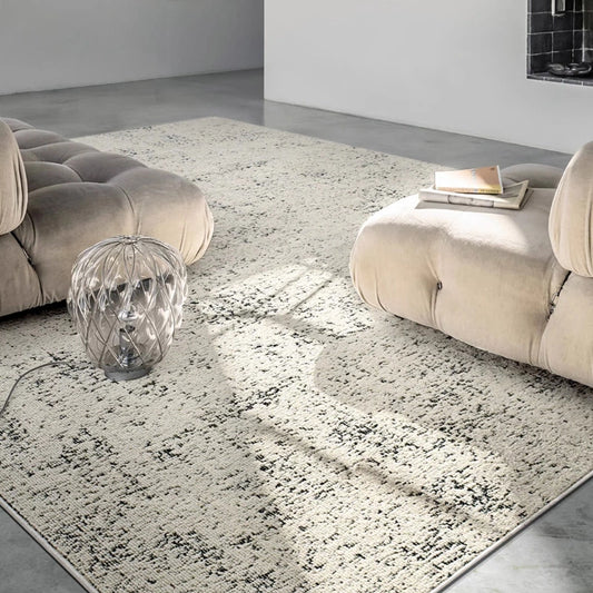 close-up of a textured beige and black area rug showing soft surface and detailed pattern