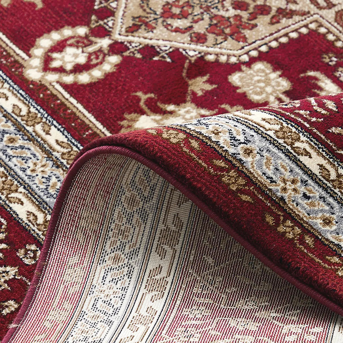 close-up of rug edge showing thick durable construction and detailed pattern