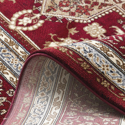 close-up of rug edge showing thick durable construction and detailed pattern