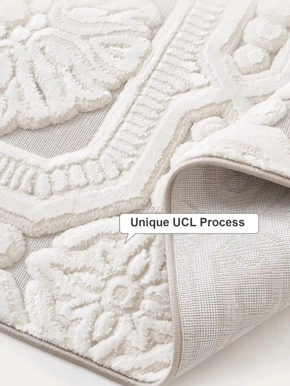A close-up of a white rug with a unique UCL process, featuring embossed textures and intricate patterns for a soft, luxurious feel