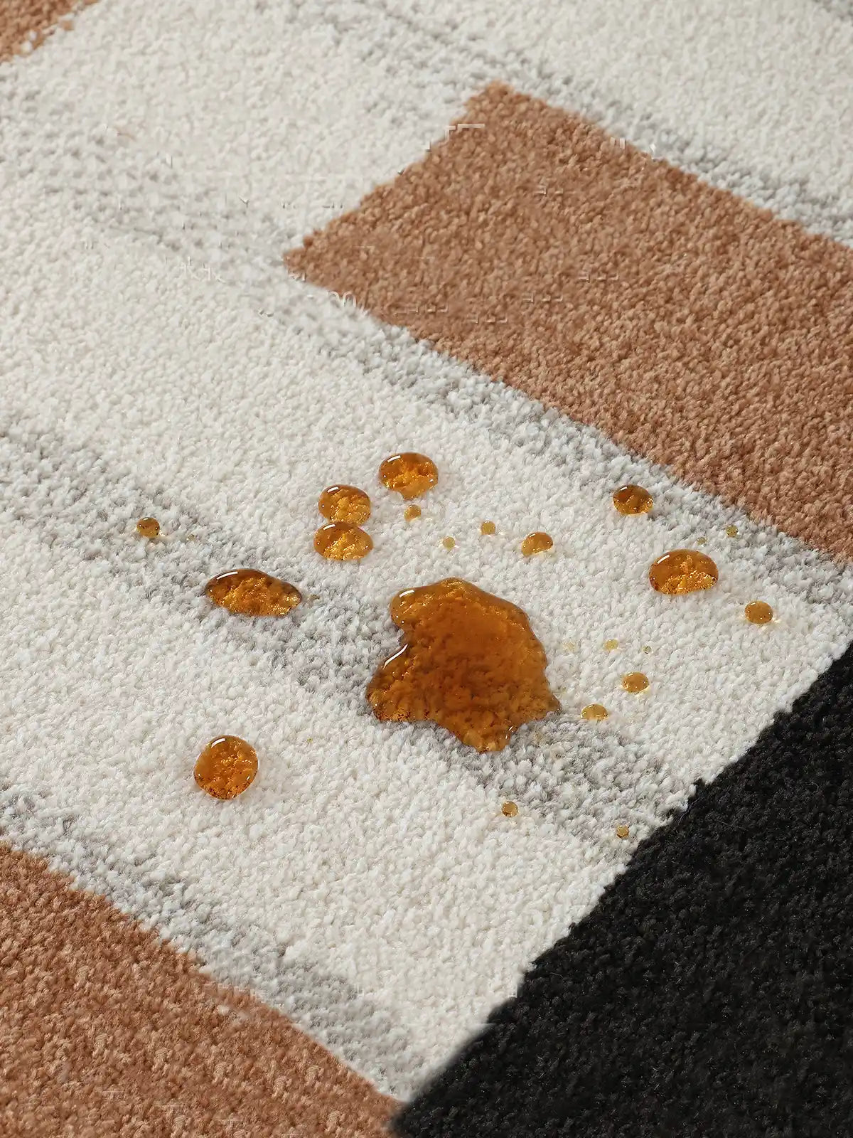 Close-up of a waterproof checkered rug with spilled liquid on surface, showing stain-resistant fiber texture