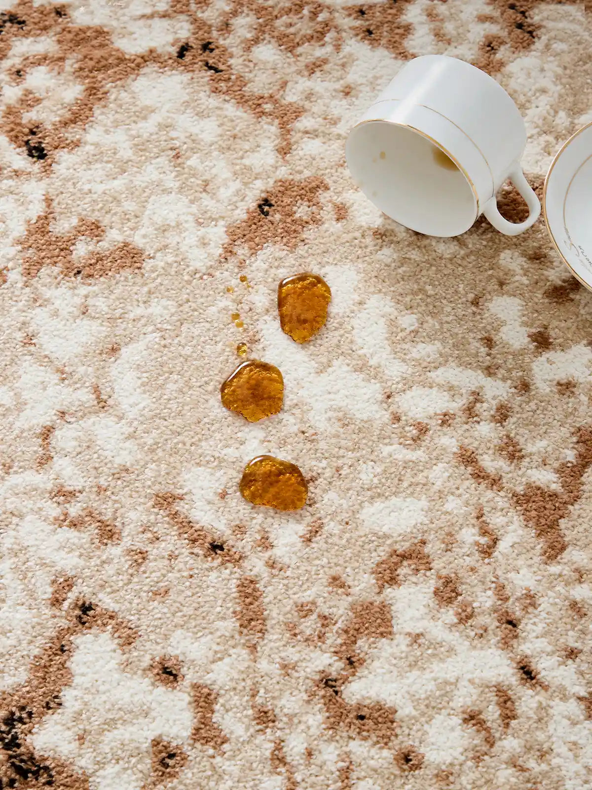 Liquid drops on beige rug surface showing waterproof and stain-resistant performance