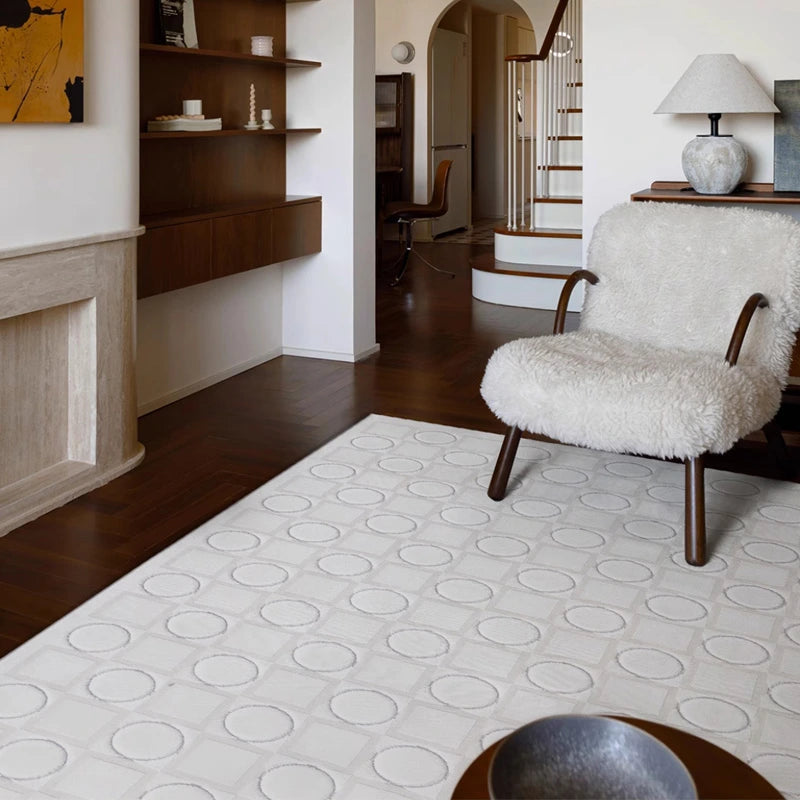 White 3D plush geometric rug with circle and square patterns, adding texture and dimension to a cozy living room with warm-toned furniture and artistic decor #Series_Modern Geometry