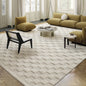 Modern living room featuring a wool rug with a checkered texture, paired with mustard yellow furniture and neutral decor elements #color_Beige Texture